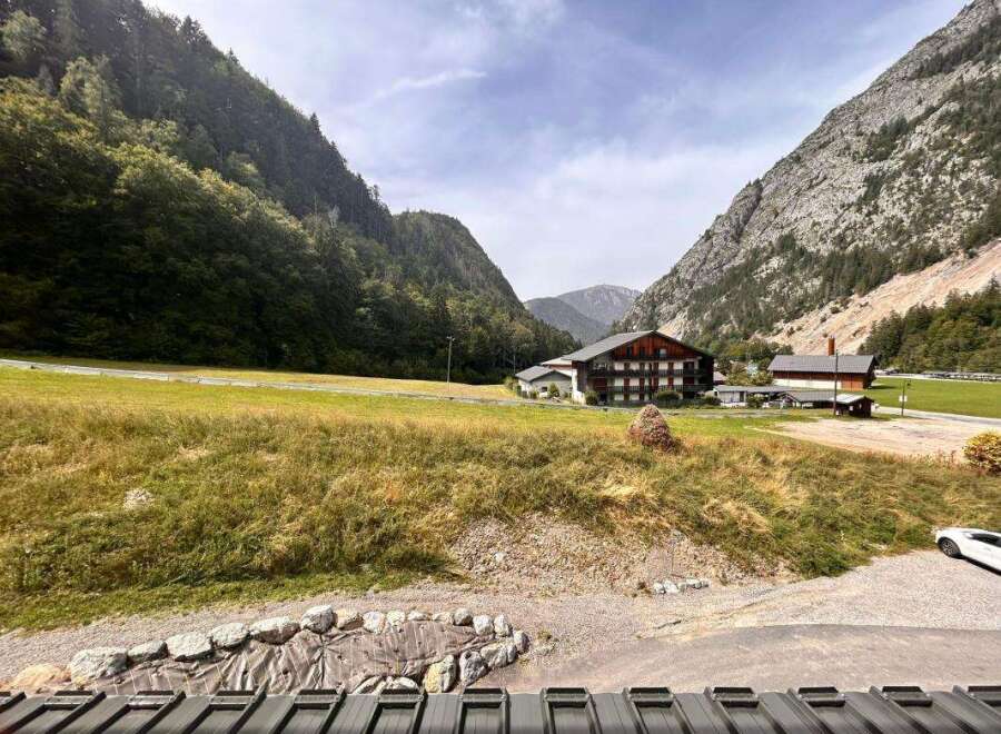 Nestled amidst breathtaking mountain scenery, this property offers a serene escape.