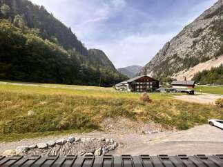 Nestled amidst breathtaking mountain scenery, this property offers a serene escape.