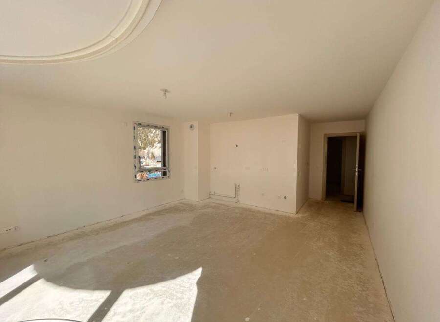 Discover this unfinished interior space, perfect for customization.