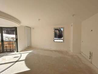 This unfinished interior space offers a blank canvas for your dream home.