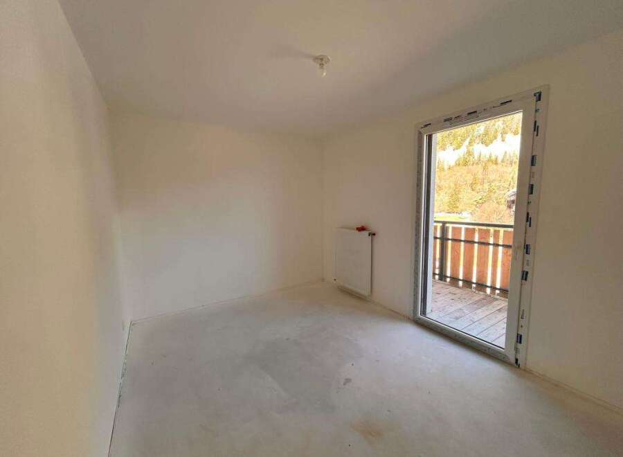 Discover this unfinished room, ready for your personal touch.