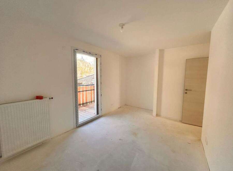 Discover this unfinished room, perfect for customization.