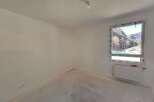 Discover this unfinished room, ready for your personal touch.