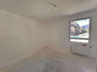 Discover this unfinished room, ready for your personal touch.