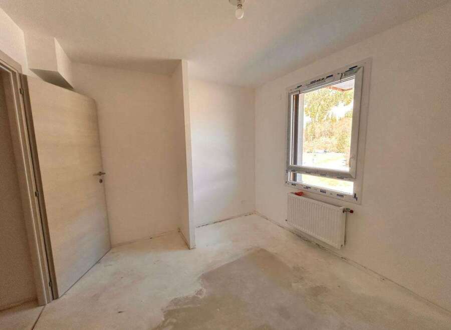 Discover this unfinished room, perfect for customization.