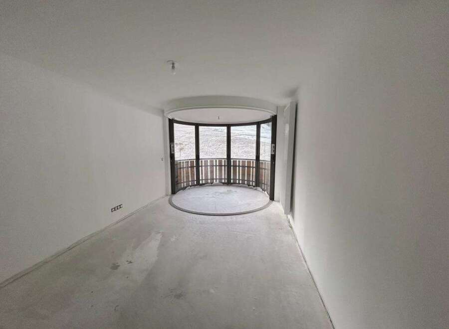 Discover this unfinished interior space, perfect for customization.