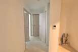 Explore this spacious hallway, featuring multiple doorways leading to different rooms.