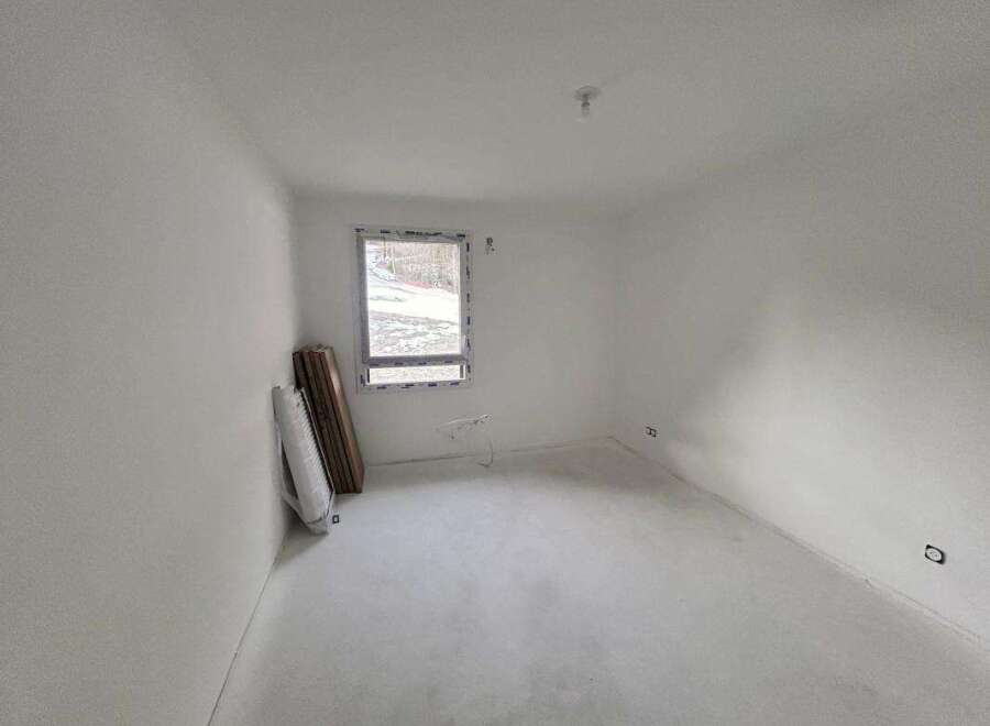 This unfinished room offers a blank canvas for your dream home.