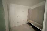 This bathroom is currently undergoing renovation, featuring a bathtub ready for installation.