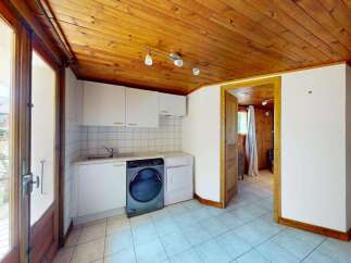 Discover this charming laundry area featuring a washing machine and dryer, perfect for keeping up with household chores.