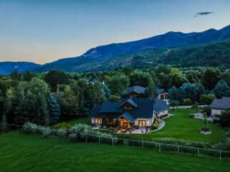 Nestled against a backdrop of majestic mountains, this stunning residence offers an idyllic retreat.