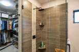 Experience luxury and organization in this stunning master suite, featuring a spacious walk-in closet with ample shelving and hanging space.
