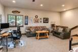 This inviting living space features a comfortable leather sofa and armchair, perfect for relaxing after a long day.