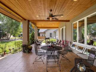 Enjoy outdoor living at its finest on this expansive covered patio, perfect for entertaining or relaxing.