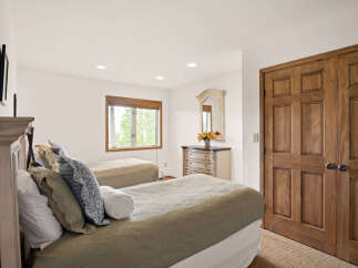 This charming bedroom features two comfortable beds, perfect for accommodating guests or family.