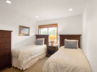 This charming bedroom features two comfortable twin beds, perfect for accommodating guests or family.