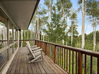 Enjoy breathtaking mountain views from this expansive deck, perfect for relaxing or entertaining.