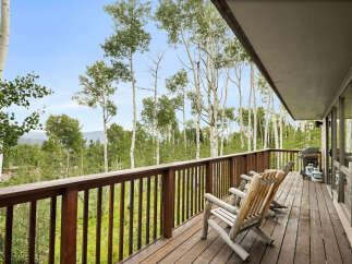 Enjoy breathtaking mountain views from this expansive deck, perfect for outdoor entertaining or quiet relaxation.