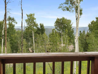 Experience the serene beauty of this mountain retreat, offering breathtaking views of rolling hills and lush aspen forests.