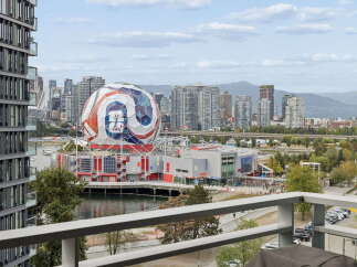 Experience breathtaking city and water views from this stunning property, featuring a modern architectural design and a private balcony perfect for enjoying the vibrant Vancouver skyline.