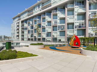 Discover modern urban living in this stunning apartment complex, featuring a vibrant rooftop playground perfect for families.
