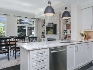 Experience modern living in this stunning open-concept kitchen and dining area.