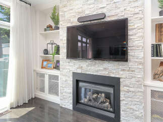 Experience modern living with this stunning fireplace and entertainment center.