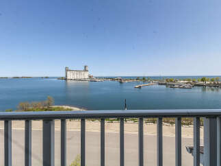 Enjoy breathtaking waterfront views from this stunning property, featuring a picturesque marina and a historic grain terminal.