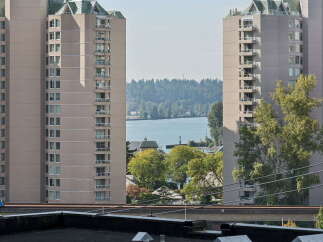 Experience urban living with stunning water and forest views from these high-rise apartments.