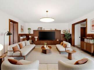 Experience modern living in this beautifully appointed living room, featuring a sleek entertainment center with a large TV and ample storage.