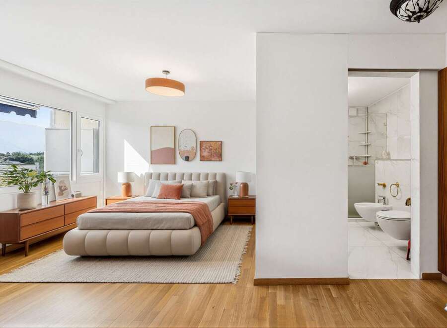 Experience modern comfort in this beautifully appointed bedroom, featuring a plush, low-profile bed and elegant bedside tables.
