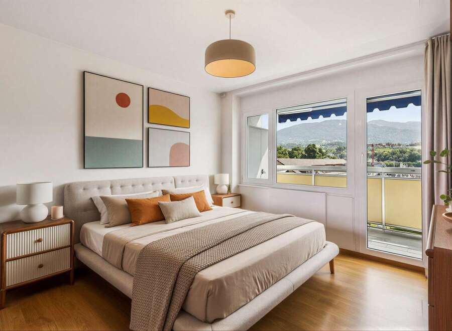 Experience modern comfort in this beautifully appointed bedroom, featuring a plush upholstered bed and tasteful abstract art.