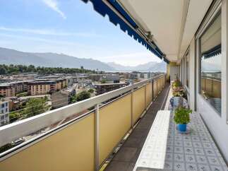 Enjoy breathtaking panoramic views from this expansive balcony, perfect for al fresco dining or simply soaking in the scenery.