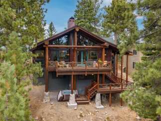 Experience the ultimate mountain retreat in this stunning log cabin, nestled amongst towering pine trees.
