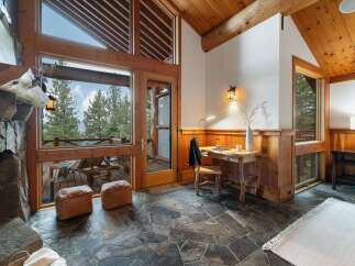 Experience rustic charm and breathtaking views in this mountain retreat.