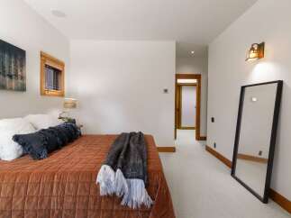 Experience rustic charm and modern comfort in this inviting bedroom.