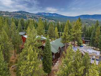 Nestled amidst a lush pine forest, this property offers a serene mountain retreat.