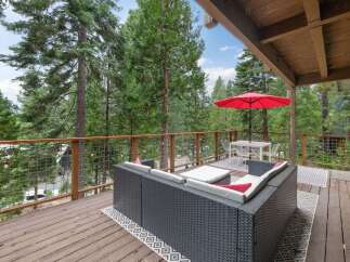 Enjoy the serene mountain views from this spacious deck, perfect for outdoor entertaining.