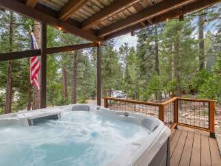 Relax and unwind in this luxurious hot tub, perfect for enjoying the serene mountain views.