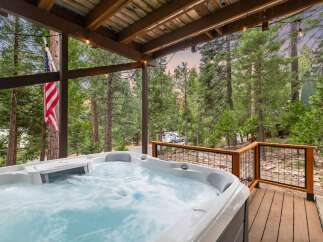 Relax and unwind in this luxurious hot tub, perfect for enjoying the serene mountain views.