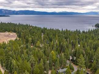 Discover your dream mountain retreat nestled amongst towering pine trees with breathtaking views of Lake Tahoe.