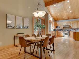 Experience the perfect blend of rustic charm and modern convenience in this stunning open-concept dining and kitchen area.