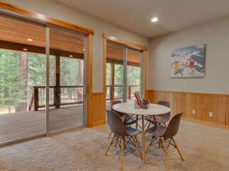 This inviting room features a cozy play area with a round table and four chairs, perfect for creative activities.