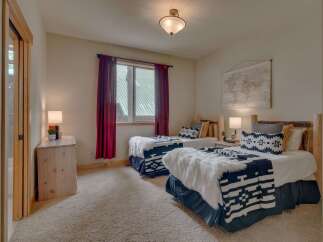 This charming bedroom features two cozy twin beds, perfect for accommodating guests or family.