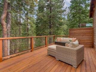 Enjoy the serene mountain lifestyle from this spacious deck, perfect for outdoor entertaining or quiet relaxation.