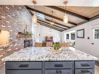 Experience the perfect blend of rustic charm and modern comfort in this stunning living space.