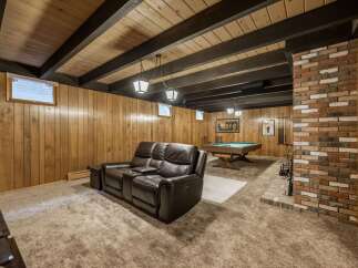 Step into this inviting finished basement, perfect for entertainment and relaxation.