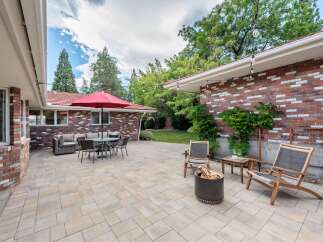 Enjoy outdoor living in this spacious backyard featuring a large paver patio perfect for entertaining.