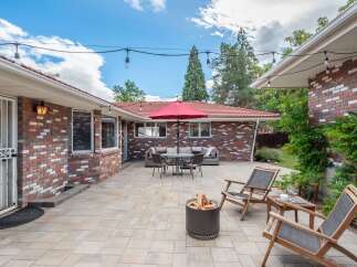 Enjoy outdoor living in this spacious backyard featuring a large paver patio perfect for entertaining.