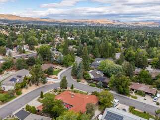 Discover this stunning property nestled in a serene, tree-lined neighborhood with breathtaking mountain views.